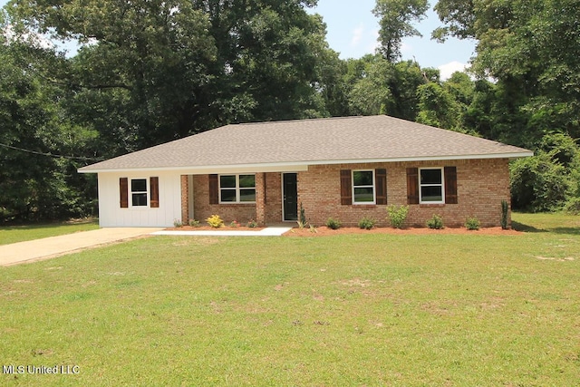136 Childress Rd, Lucedale, MS 39452 - ranch-style house with a front lawn, brick siding, and roof with shingles