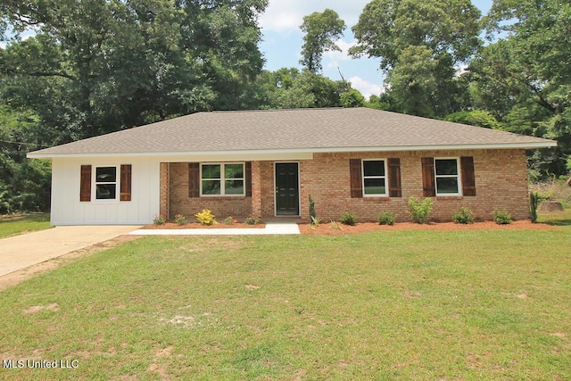 136 Childress Rd, Lucedale, MS 39452 - ranch-style home with a front lawn, roof with shingles, and brick siding