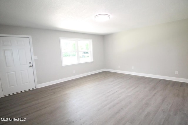 136 Childress Rd, Lucedale, MS 39452 - empty room featuring dark wood-type flooring and baseboards