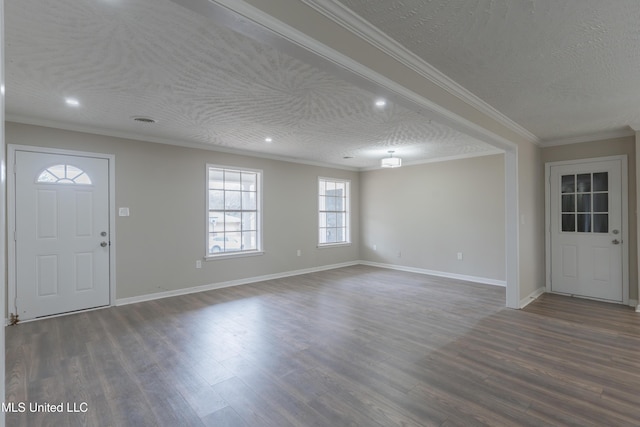 foyer featuring dark wood finished floors, a textured ceiling, and crown molding