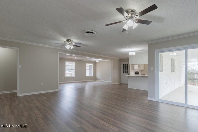 unfurnished living room with baseboards, dark wood-style flooring, ceiling fan, a textured ceiling, and crown molding