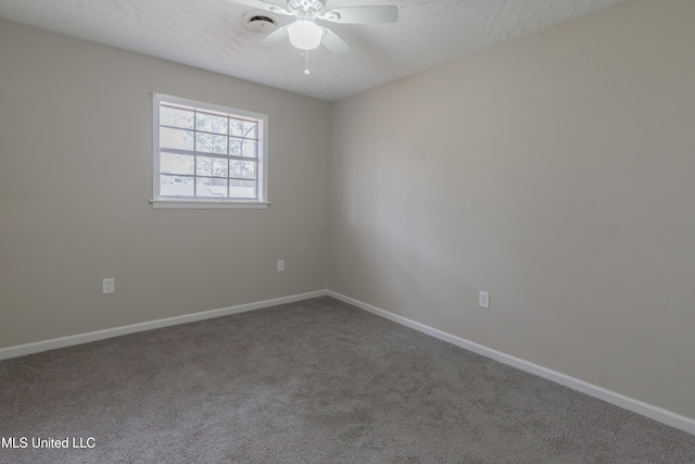 carpeted empty room with baseboards, a textured ceiling, and a ceiling fan