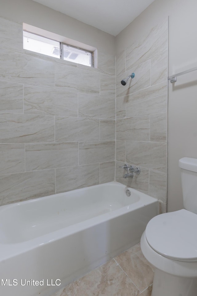 bathroom featuring toilet and shower / washtub combination