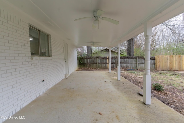 view of patio featuring a ceiling fan and fence