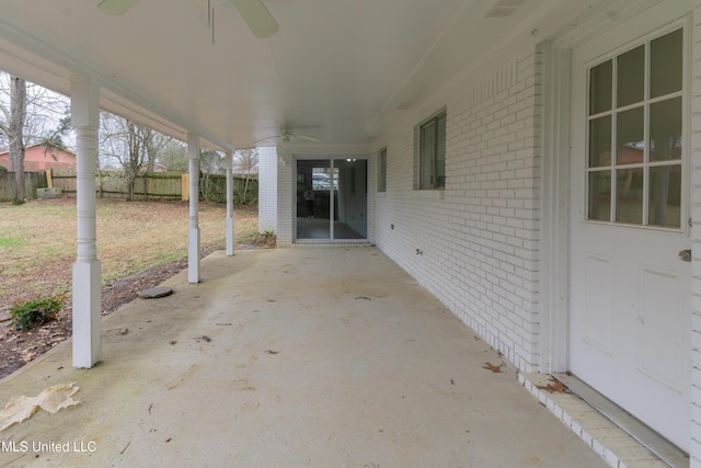 view of patio / terrace with a ceiling fan and fence