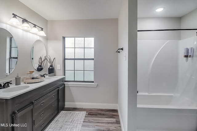 bathroom featuring vanity and hardwood / wood-style floors