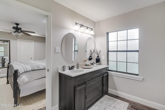 bathroom with vanity, hardwood / wood-style flooring, and ceiling fan