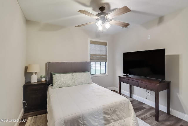 bedroom with dark wood-type flooring and ceiling fan