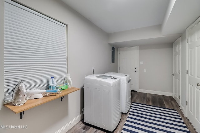 laundry area with dark wood-type flooring, electric panel, and separate washer and dryer