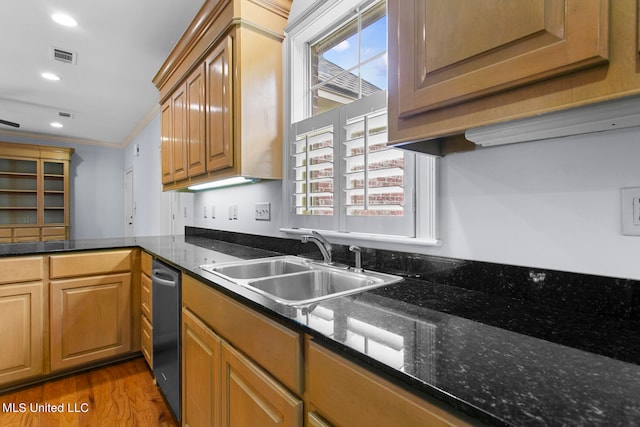 kitchen with sink, crown molding, hardwood / wood-style flooring, and dark stone counters