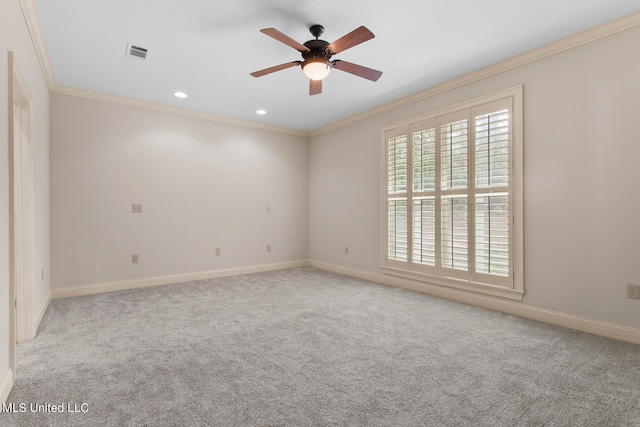 empty room with light carpet, crown molding, and ceiling fan