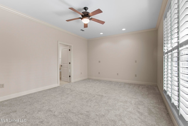 carpeted empty room with ornamental molding and ceiling fan