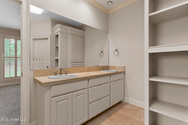 bathroom with vanity, crown molding, and tile patterned floors