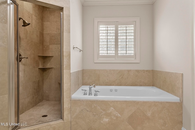 bathroom with ornamental molding and separate shower and tub