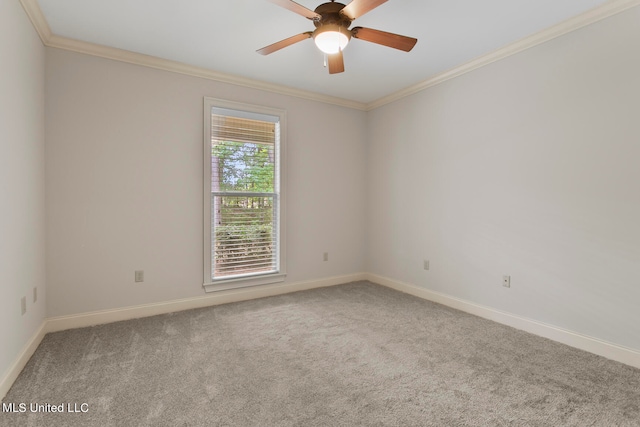 spare room featuring crown molding, carpet flooring, and ceiling fan