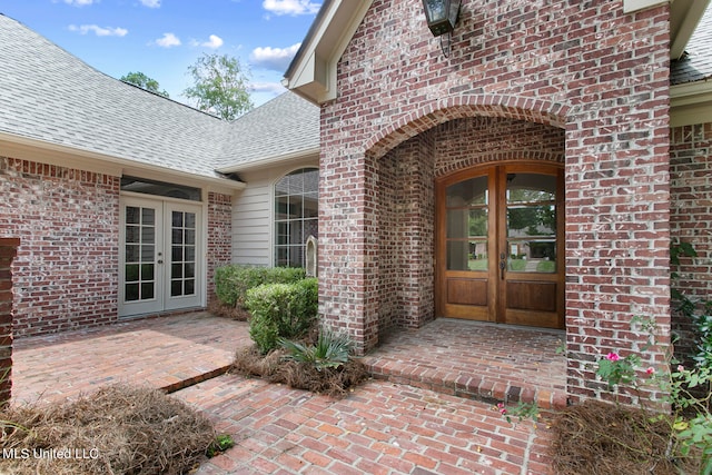 property entrance featuring french doors