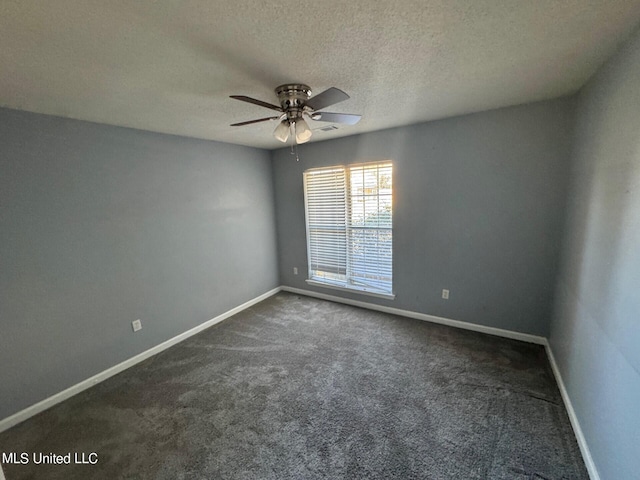 9193 S Kaitlyn Dr, Walls, MS 38680 - spare room featuring a ceiling fan, baseboards, a textured ceiling, and dark colored carpet