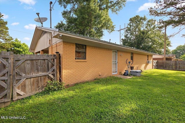 791 Leach St, Yazoo City, MS 39194 - back of property with brick siding and a gate