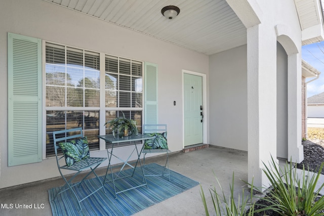 property entrance featuring covered porch