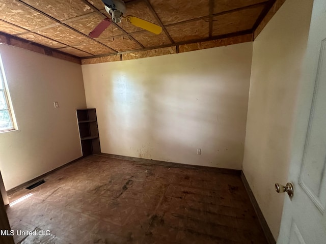 unfurnished room featuring ceiling fan