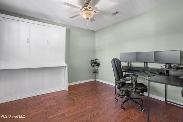 office featuring dark wood-type flooring, a textured ceiling, and ceiling fan