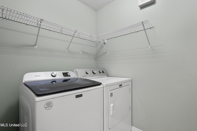 laundry room with separate washer and dryer