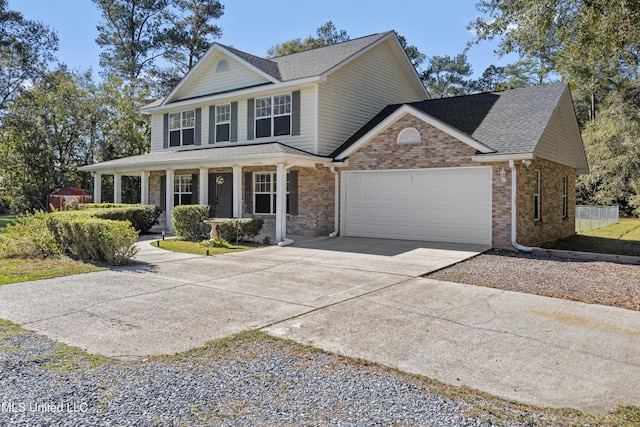 view of front property featuring a porch and a garage