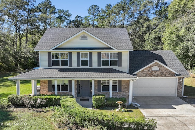 view of front of property with a garage and a porch