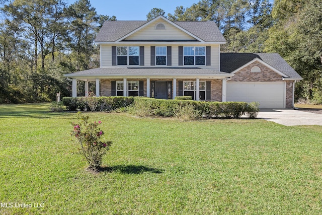 view of front of house with a garage, covered porch, and a front lawn