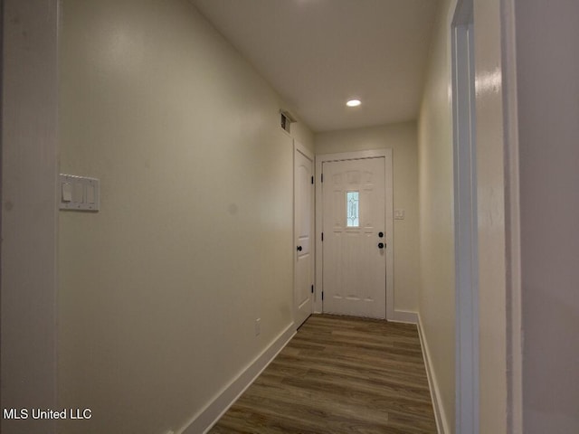 entryway with baseboards, dark wood finished floors, and recessed lighting