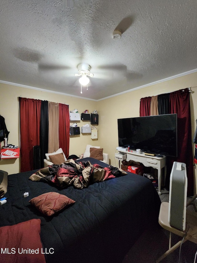 bedroom featuring ceiling fan, a textured ceiling, and ornamental molding