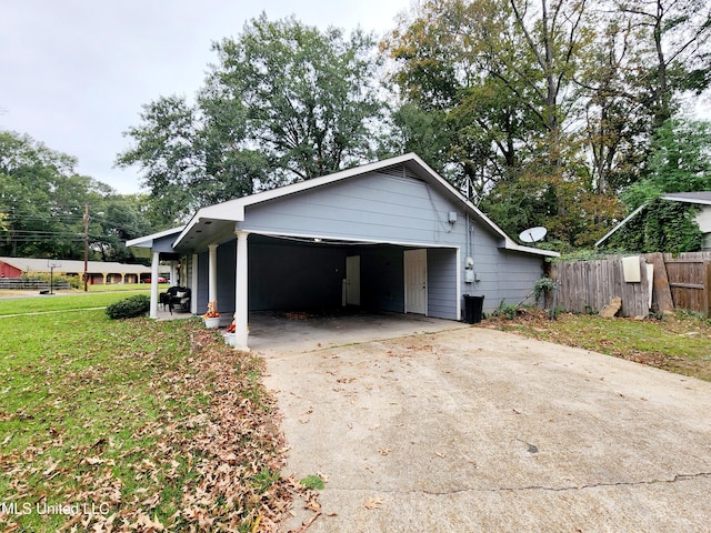 view of side of home with a yard and a garage