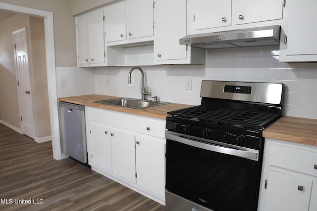 kitchen with sink, tasteful backsplash, dark hardwood / wood-style flooring, stainless steel appliances, and white cabinets