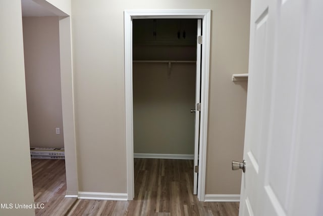 hallway featuring hardwood / wood-style floors