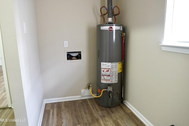 utility room with gas water heater