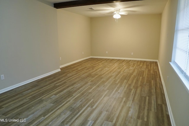 unfurnished room featuring hardwood / wood-style floors, beam ceiling, and ceiling fan