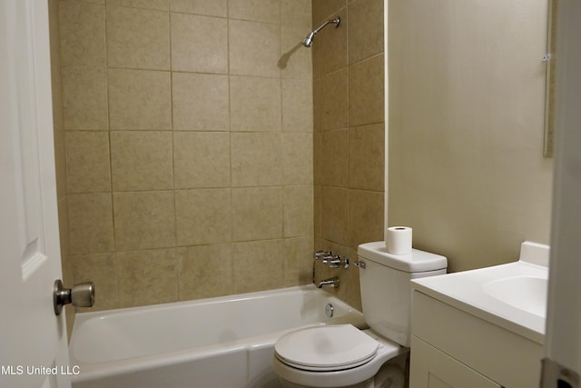 full bathroom with vanity, tiled shower / bath, and toilet