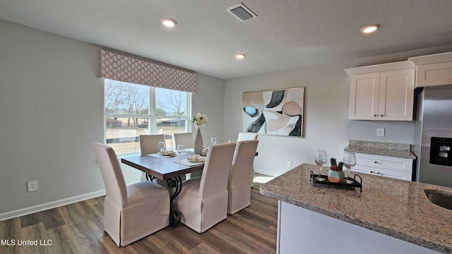 dining space featuring recessed lighting, baseboards, dark wood-style flooring, and visible vents