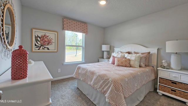 bedroom with carpet flooring and baseboards