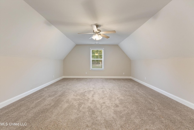 additional living space with carpet, ceiling fan, and lofted ceiling