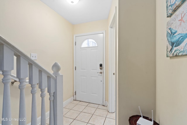 entryway with light tile patterned floors