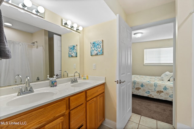 bathroom featuring tile patterned floors and vanity