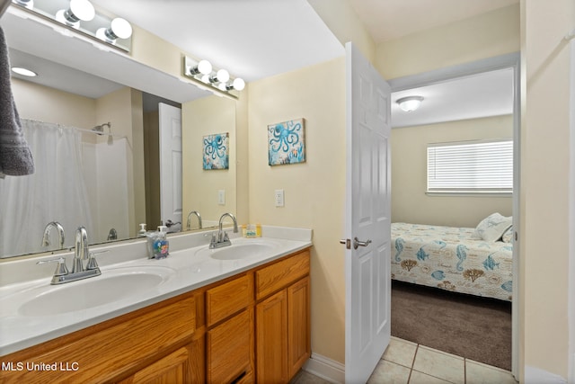 1664 Beach Blvd Unit 90, Biloxi, MS 39531 - full bathroom featuring double vanity, tile patterned floors, and ensuite bathroom