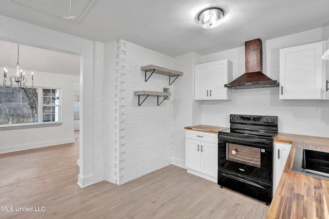 kitchen with open shelves, wooden counters, wall chimney exhaust hood, and black range with electric cooktop