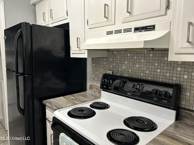 kitchen with under cabinet range hood, white cabinetry, range with electric cooktop, and backsplash