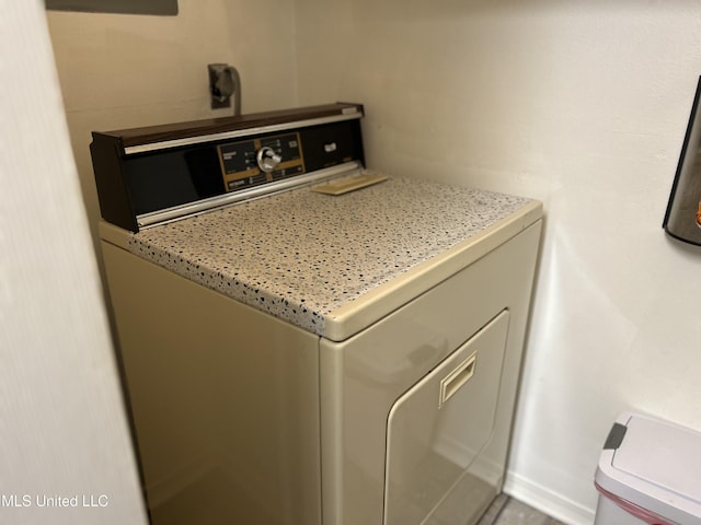 clothes washing area featuring laundry area and washer and dryer