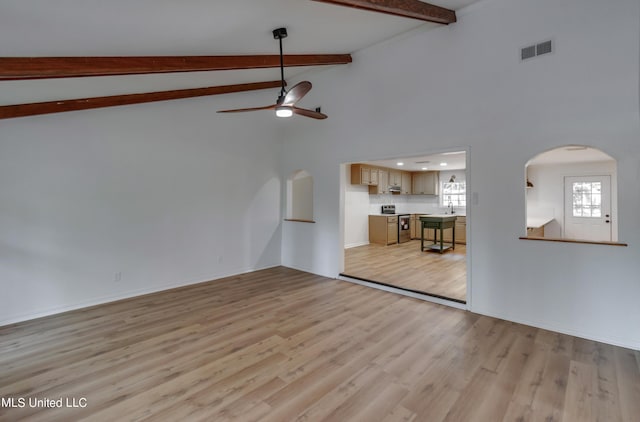 551 Holly Bush Rd, Brandon, MS 39047 - unfurnished living room featuring arched walkways, a ceiling fan, light wood-type flooring, a sink, and baseboards