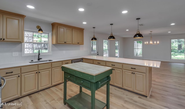 551 Holly Bush Rd, Brandon, MS 39047 - kitchen with a sink, a peninsula, light wood finished floors, light countertops, and recessed lighting