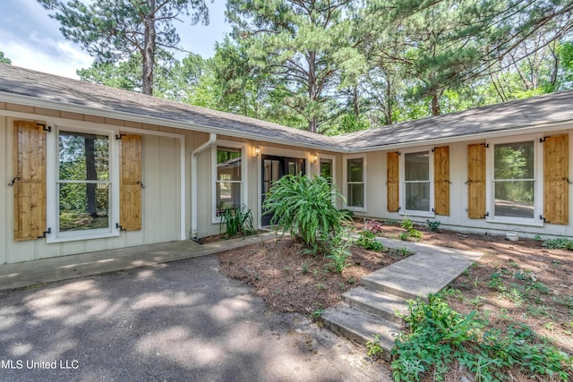 551 Holly Bush Rd, Brandon, MS 39047 - doorway to property with roof with shingles