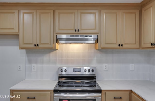551 Holly Bush Rd, Brandon, MS 39047 - kitchen featuring stainless steel electric stove, under cabinet range hood, backsplash, light stone countertops, and cream cabinets